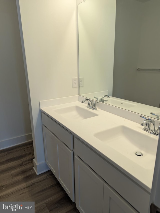 bathroom featuring vanity and wood-type flooring