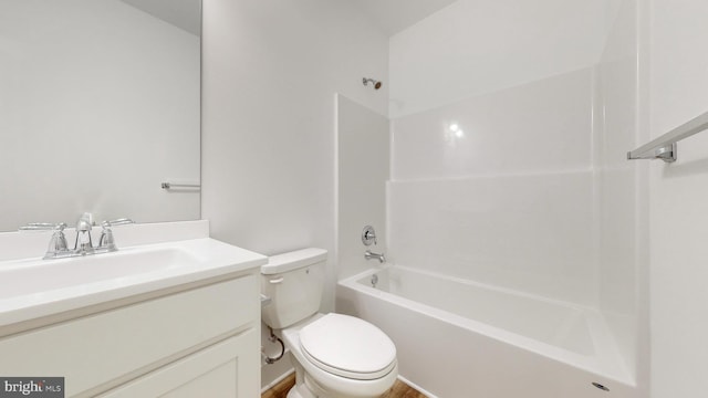 full bathroom with vanity, washtub / shower combination, and toilet