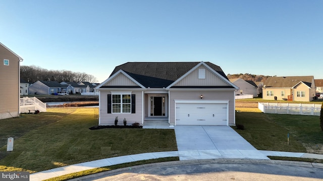 view of front facade with a garage and a front yard