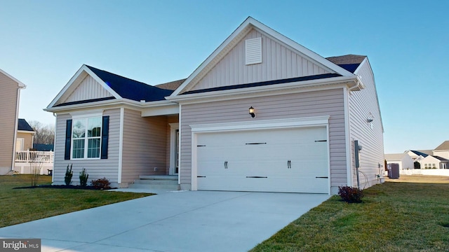 view of front of home featuring a front yard, a garage, and central air condition unit