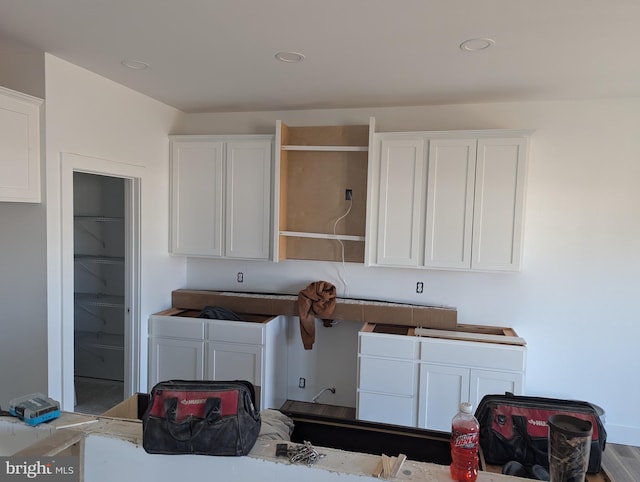 laundry area with wood-type flooring