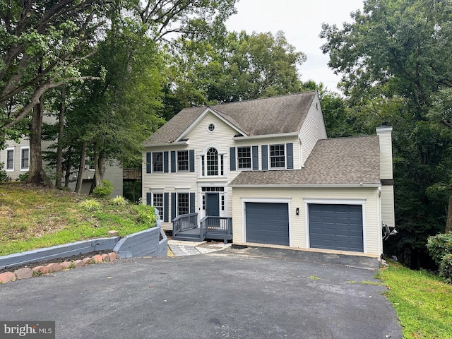 colonial home with a garage