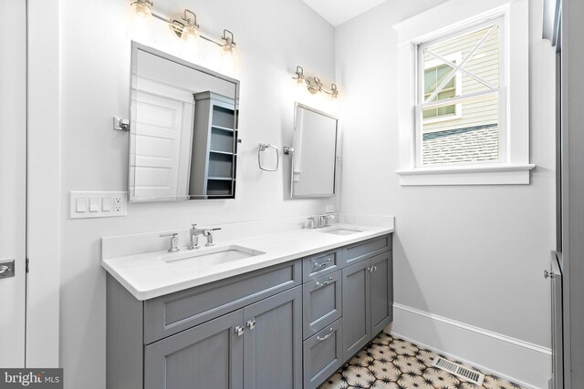 bathroom featuring tile patterned floors and vanity