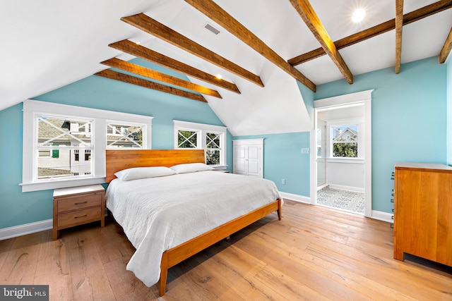 bedroom with vaulted ceiling with beams, light wood-style flooring, visible vents, and baseboards