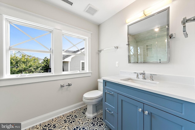 full bath featuring tile patterned floors, baseboards, visible vents, and vanity