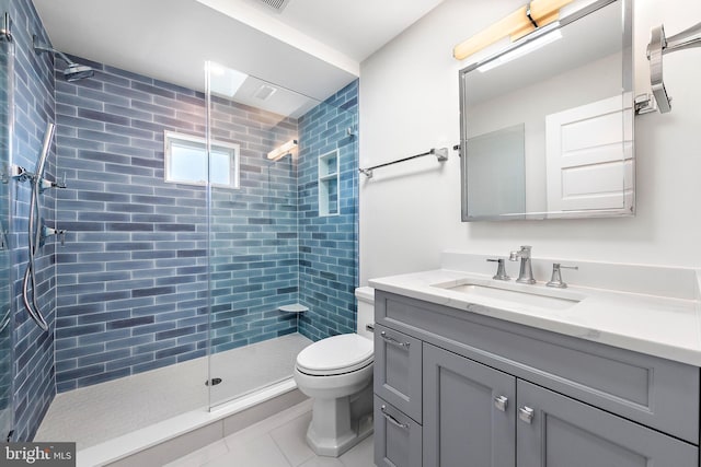 full bathroom featuring a walk in shower, tile patterned flooring, vanity, and toilet