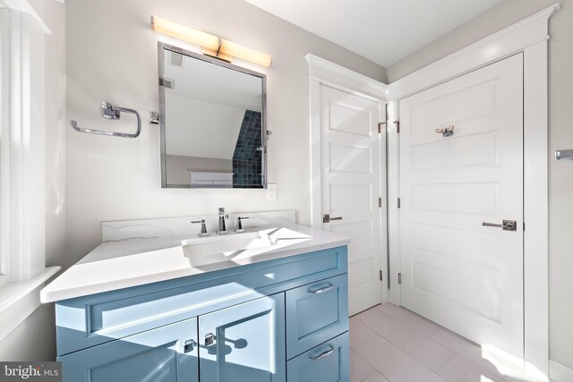 bathroom featuring tile patterned floors and vanity