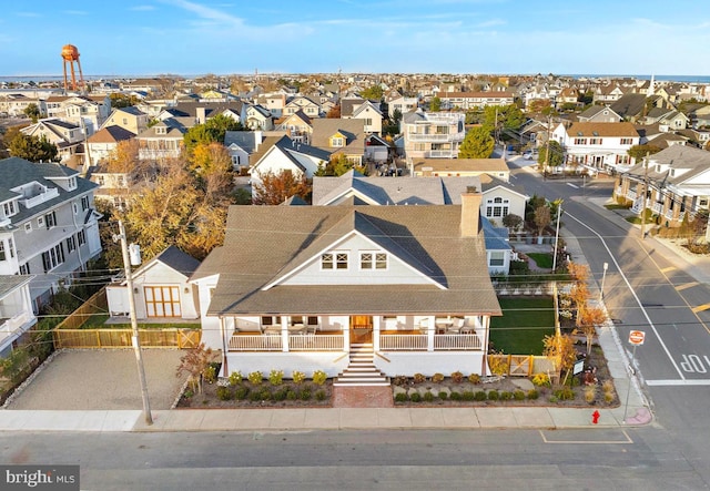 birds eye view of property with a residential view