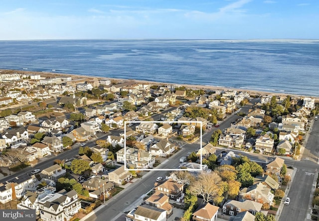 birds eye view of property featuring a water view and a residential view