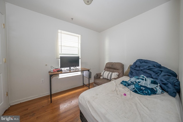 bedroom featuring wood-type flooring