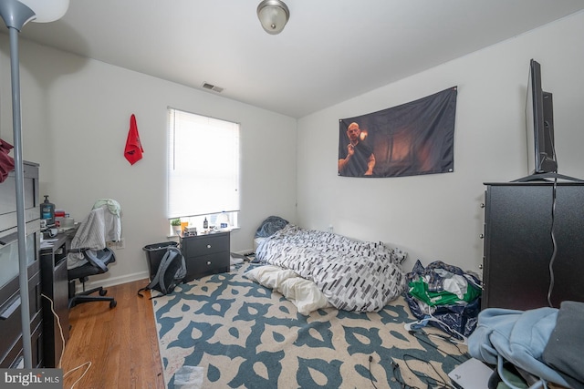 bedroom featuring wood-type flooring