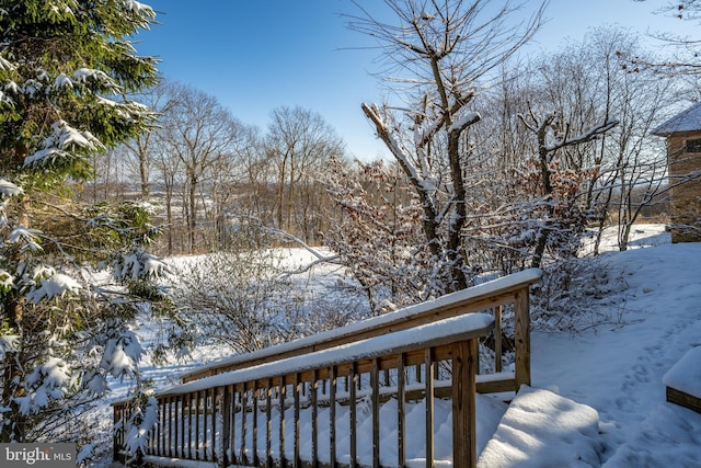 view of snow covered deck