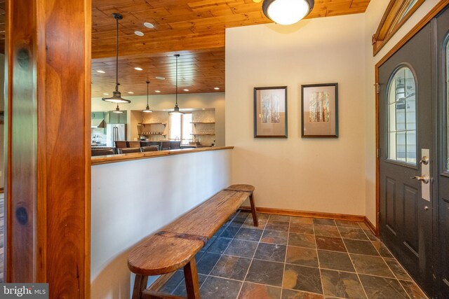 foyer with wood ceiling