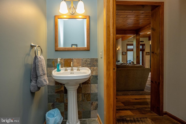 bathroom featuring a notable chandelier, wood ceiling, tile walls, and wood-type flooring