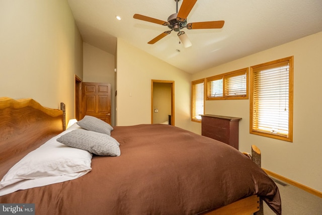 carpeted bedroom with ceiling fan and lofted ceiling