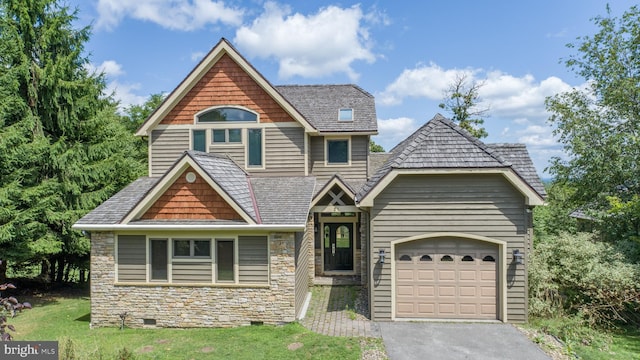 view of front facade with a garage and a front lawn