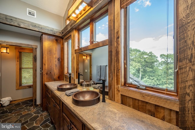 bathroom with plenty of natural light and vanity