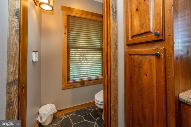 bathroom featuring tile patterned floors and toilet