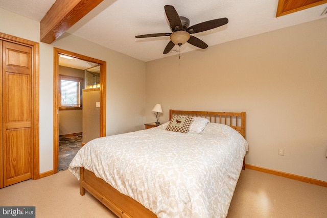 bedroom featuring ceiling fan and beamed ceiling