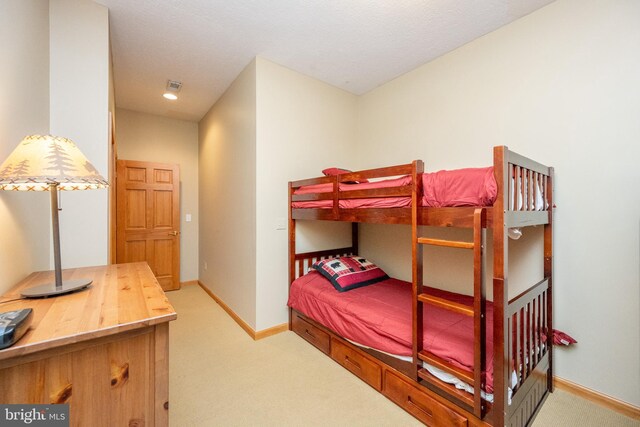 bedroom with light carpet