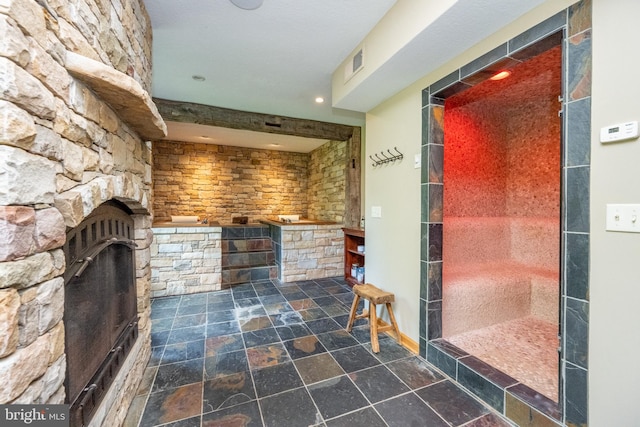 bathroom with a fireplace