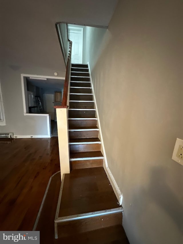 stairs with wood-type flooring