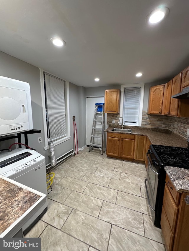 kitchen with extractor fan, sink, tasteful backsplash, and gas stove