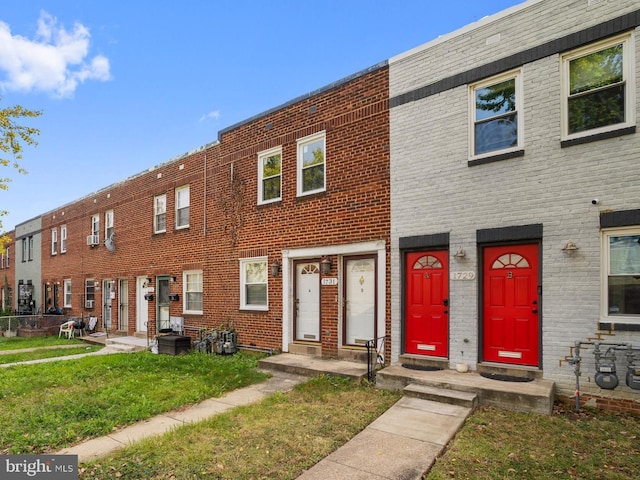 view of property featuring a front yard