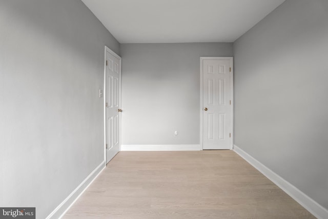 spare room featuring light hardwood / wood-style floors