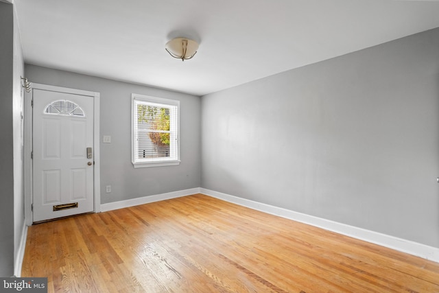 foyer entrance with light wood-type flooring