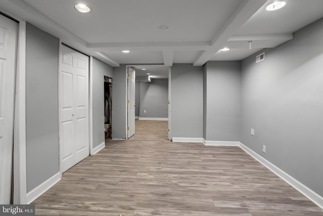 basement featuring light hardwood / wood-style floors