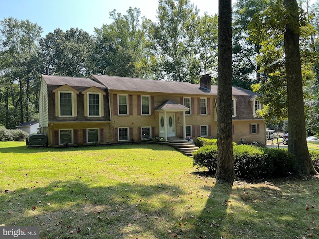 bi-level home with a front yard