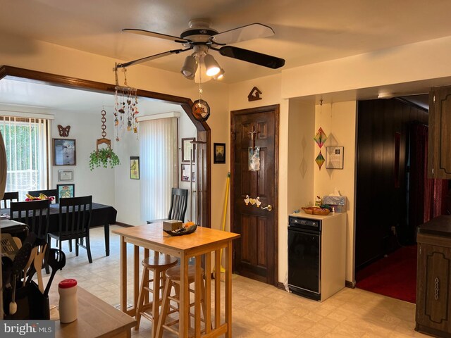 tiled dining room with ceiling fan