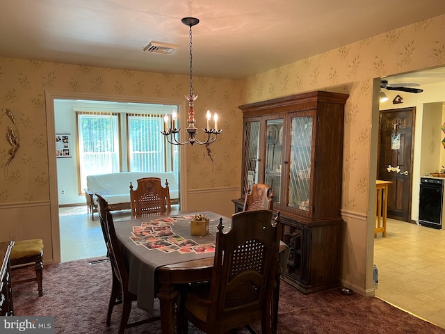 tiled dining space featuring beverage cooler and a chandelier