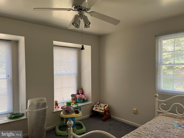 bedroom with ceiling fan and carpet floors