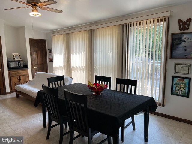 dining room with ceiling fan and light tile patterned floors