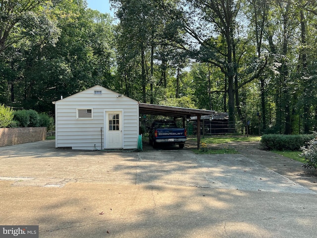 garage featuring a carport