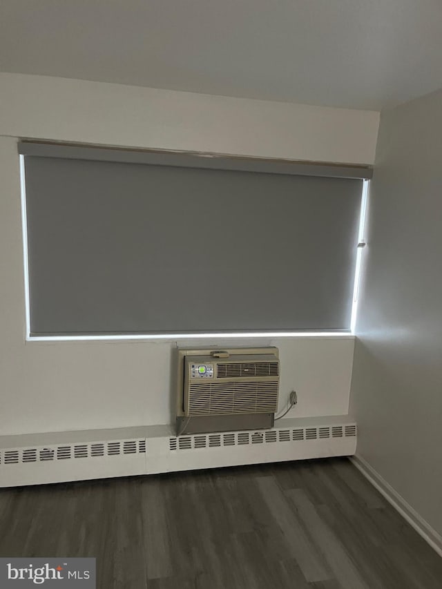 interior details featuring hardwood / wood-style flooring and a baseboard radiator