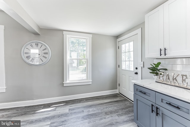 89 E Barber Ave, Woodbury, NJ 08096 - interior space with wood finished floors, a wealth of natural light, and baseboards
