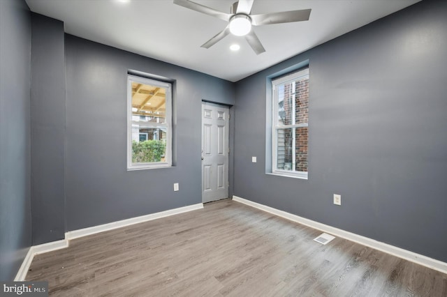 spare room featuring ceiling fan and hardwood / wood-style flooring