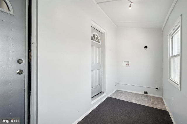 doorway with light colored carpet