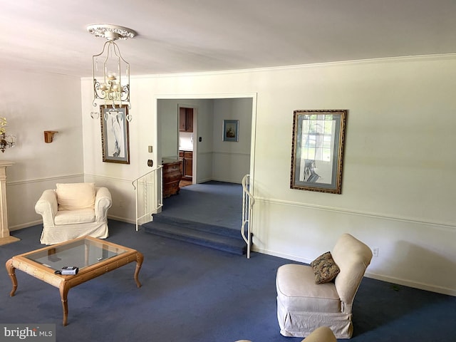 living area with ornamental molding and dark colored carpet