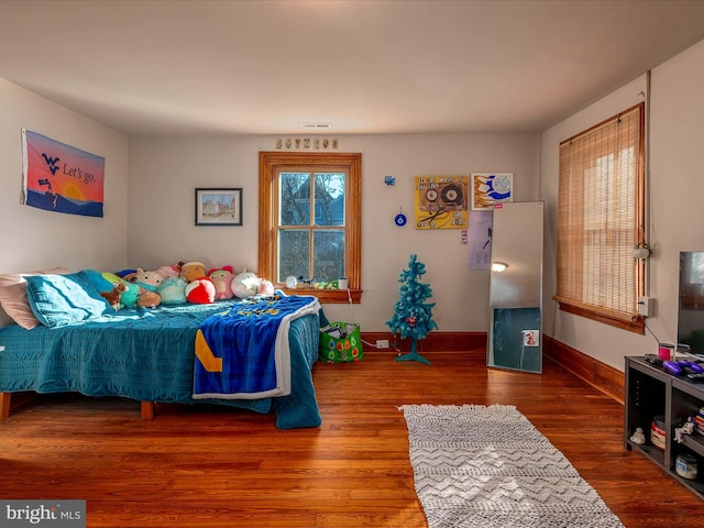 bedroom with wood-type flooring