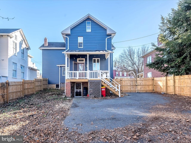 rear view of house with a porch