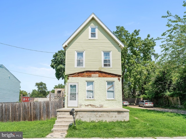 front of property featuring a front lawn