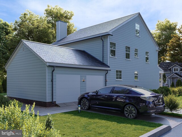 exterior space with a garage and a front yard