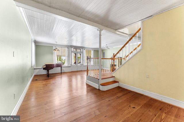 interior space with hardwood / wood-style floors, wooden ceiling, and ceiling fan