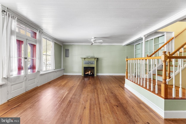 unfurnished living room with hardwood / wood-style floors and ceiling fan