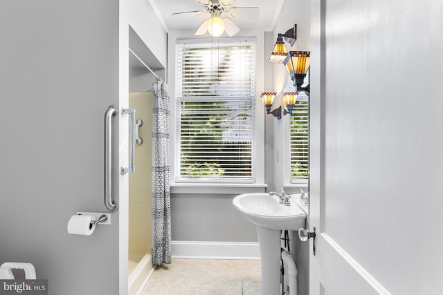 bathroom featuring plenty of natural light, ceiling fan, and walk in shower