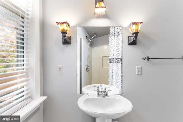 bathroom with sink and walk in shower